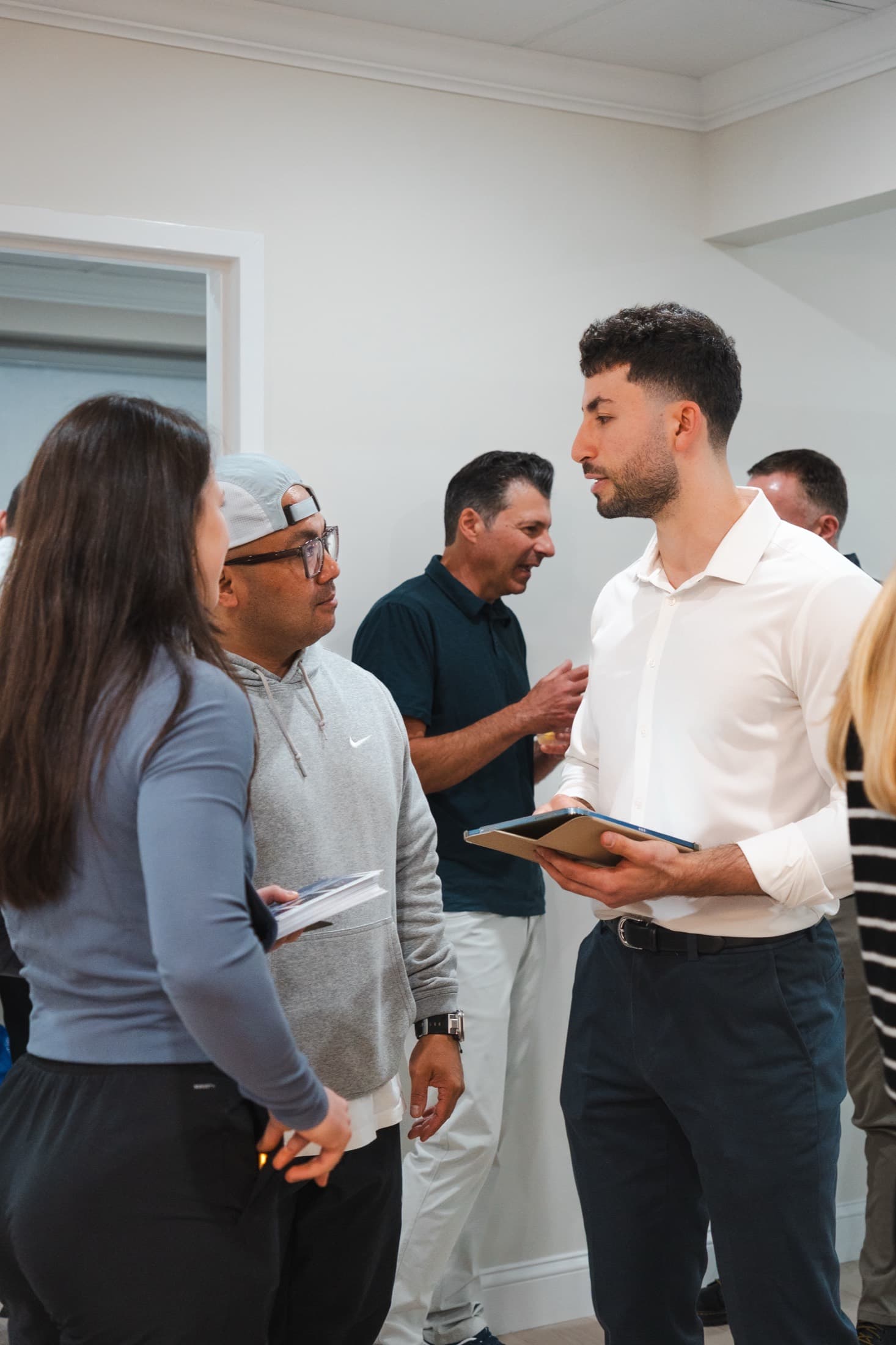A Protocol Health clinician talking with patients at the Scarsdale office